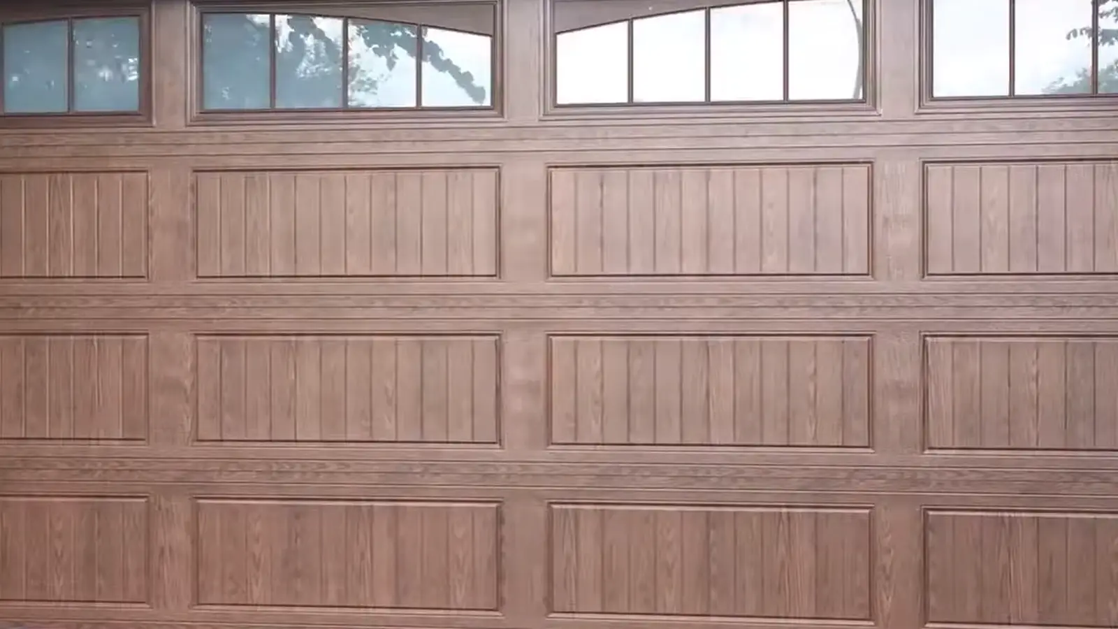 Windowed raised-panel garage door in Adams County