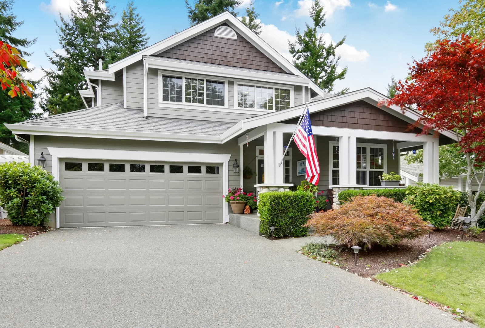 Garage door installation Arapahoe County windowed residential garage door on a craftsman-style home