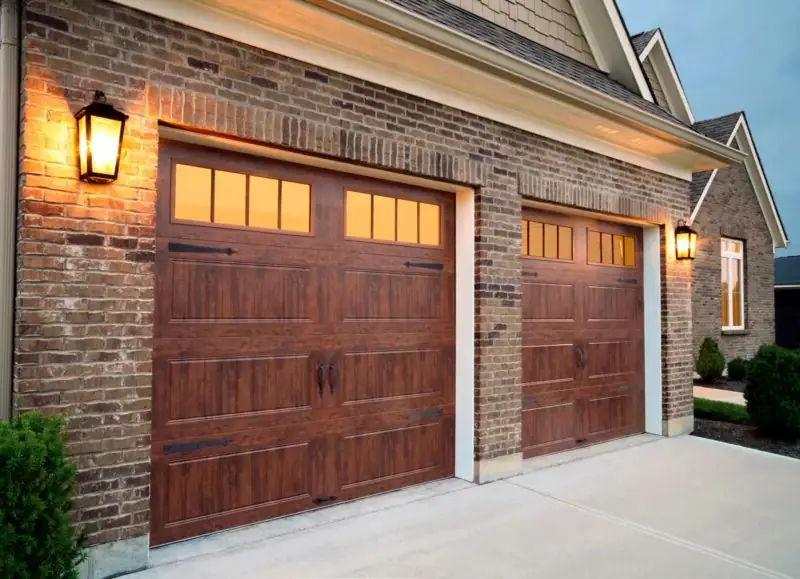 Windowed wood double garage door in Aurora