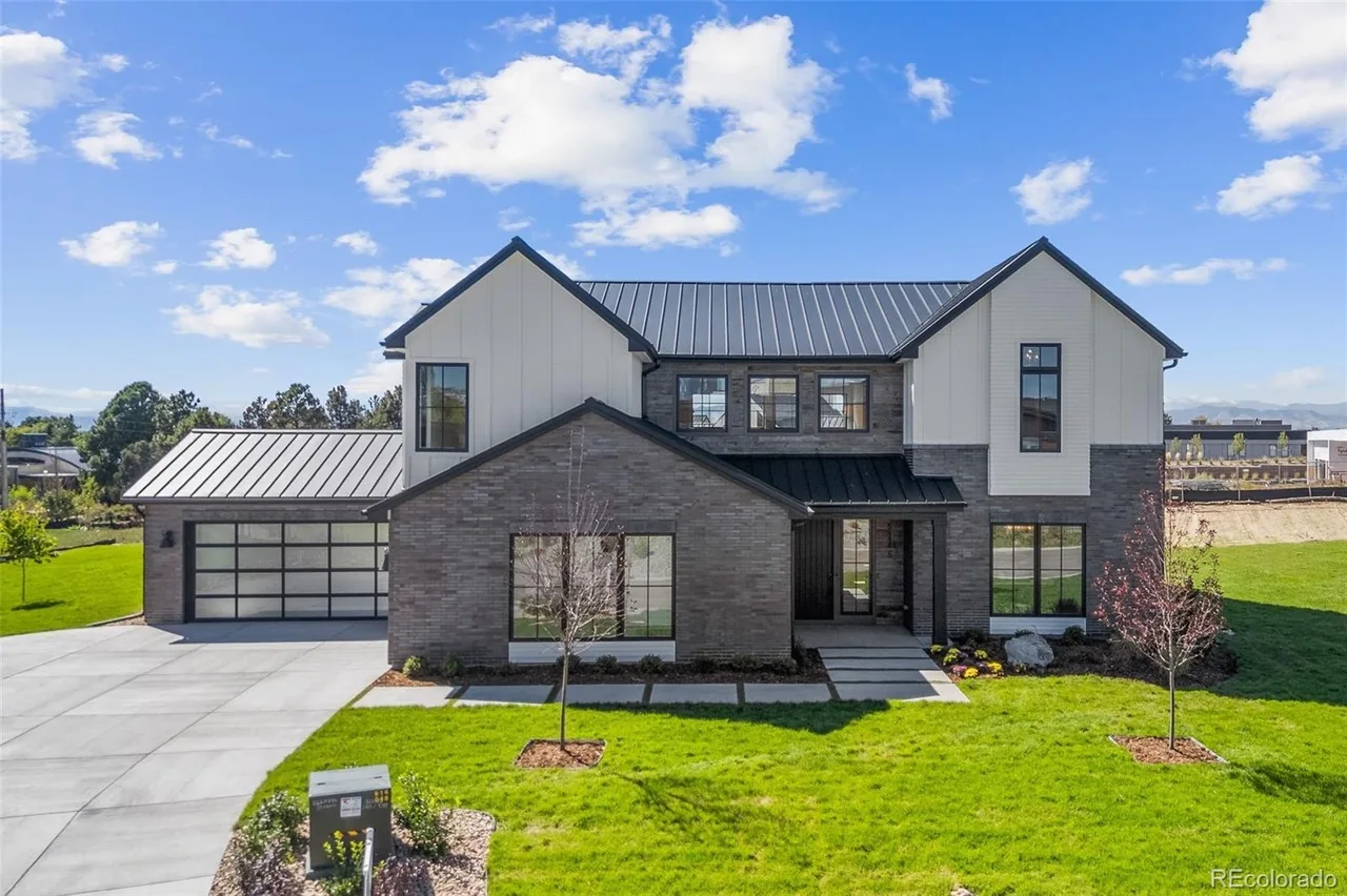 Modern black glass double garage door in Centennial