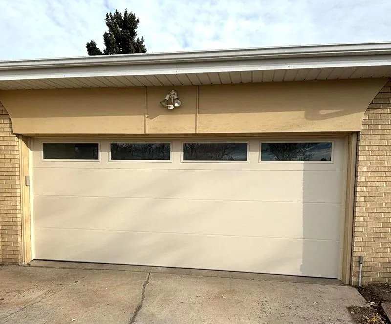 White garage door with upper windows in Centennial