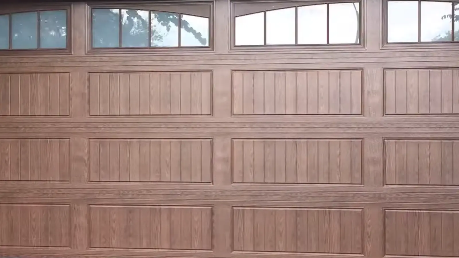 Wood raised-panel double replacement garage door in Denver