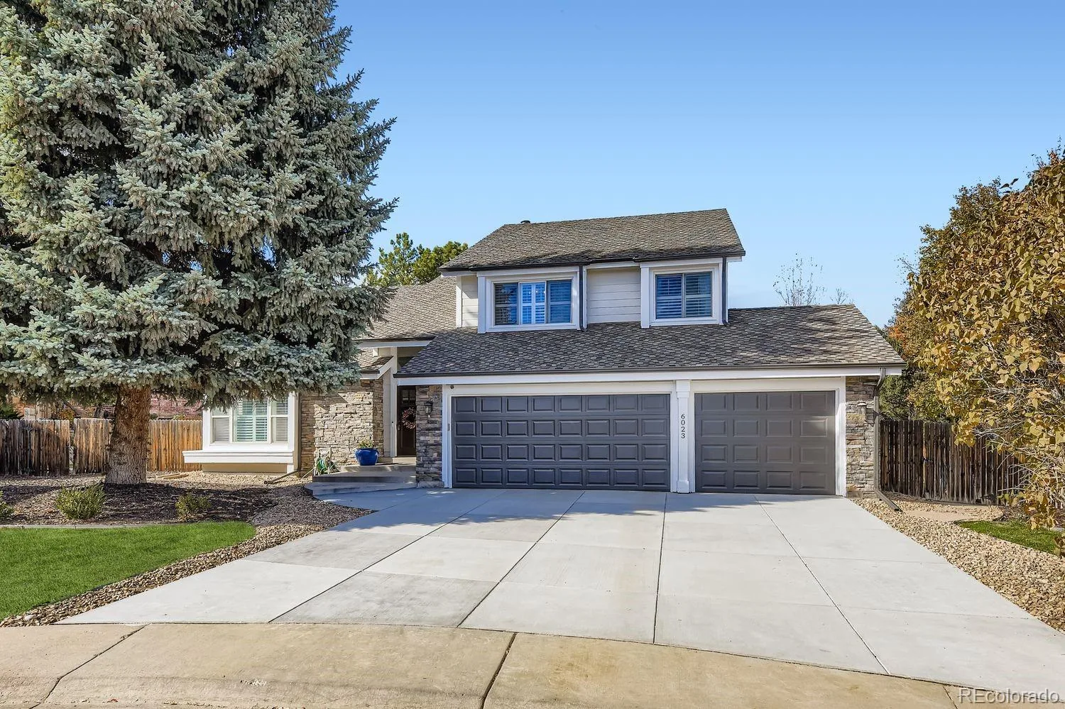 Garage door installation Greenwood Village gray raised-panel double and single garage doors