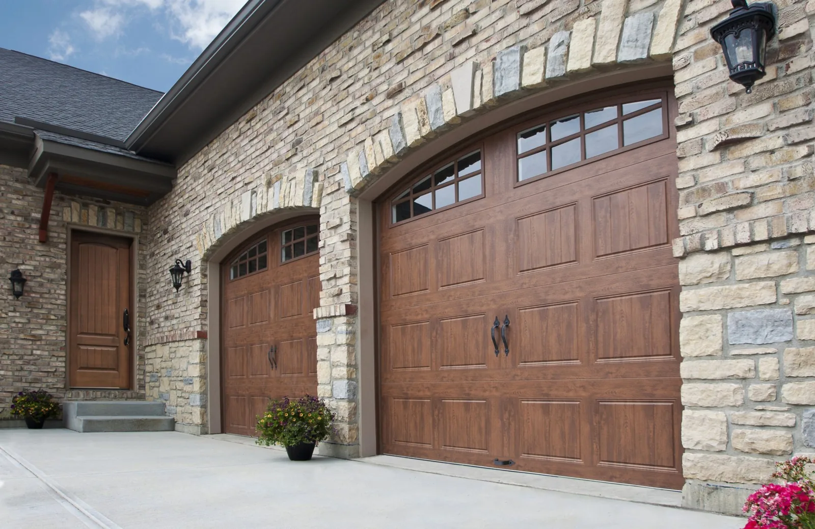 Garage door installation Greenwood Village wood carriage-house garage doors with arched windows