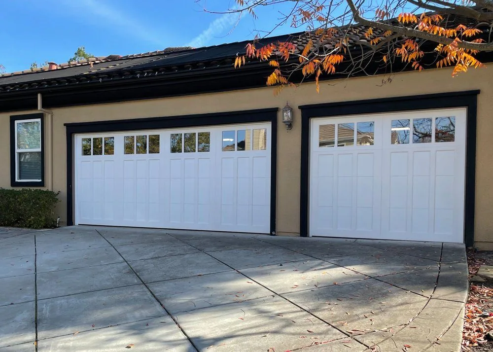Garage door installation Littleton white carriage-house double and single garage doors with windows