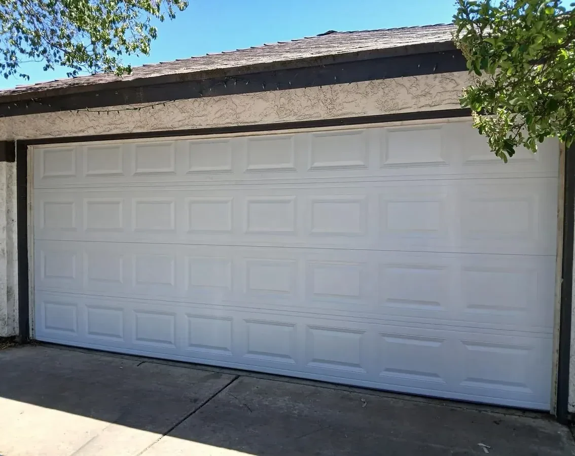 Steel raised-panel double garage door in Parker, CO
