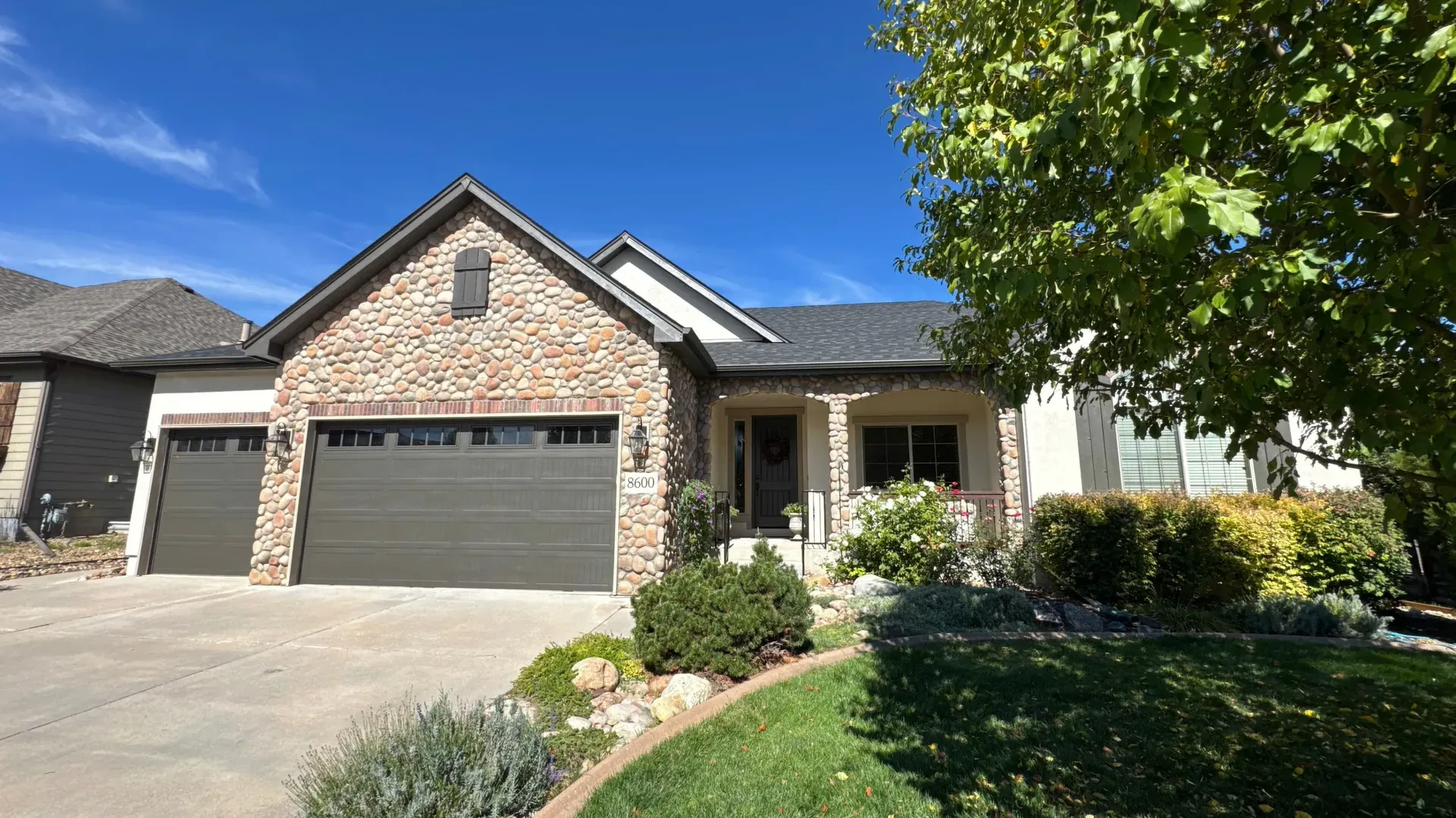 Garage door installation Adams County white carriage-style double garage doors in winter