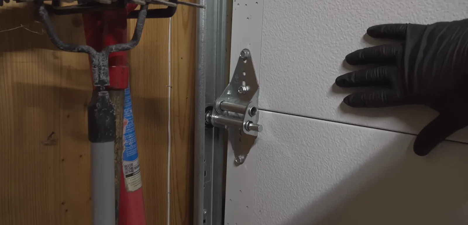 Garage door hinge and roller repair in Littleton