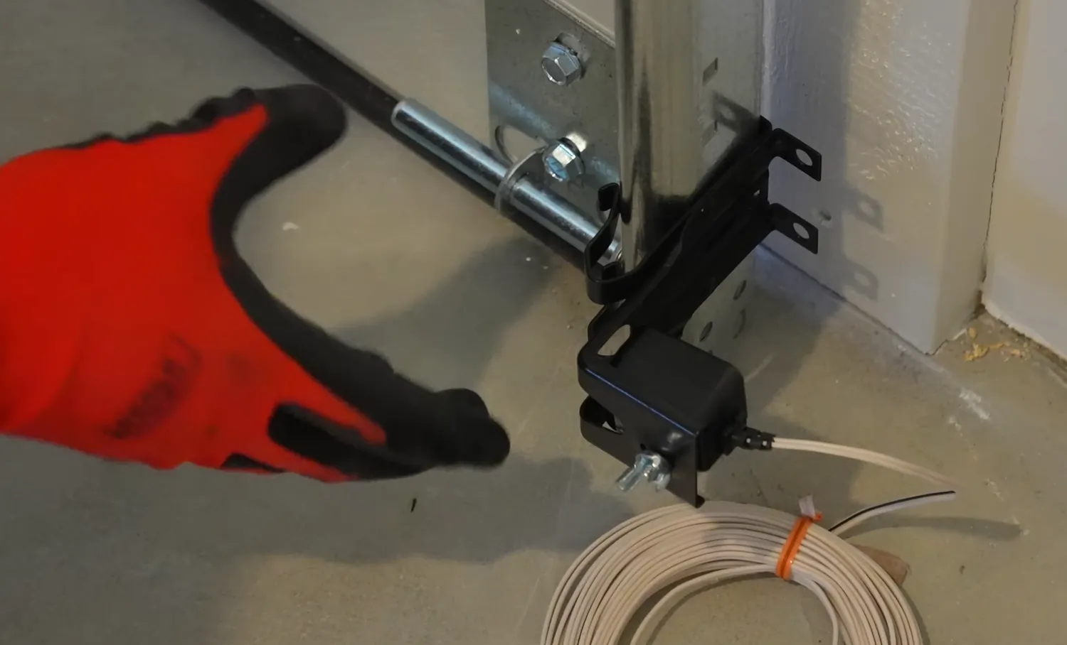 Adjusting a garage door safety sensor bracket