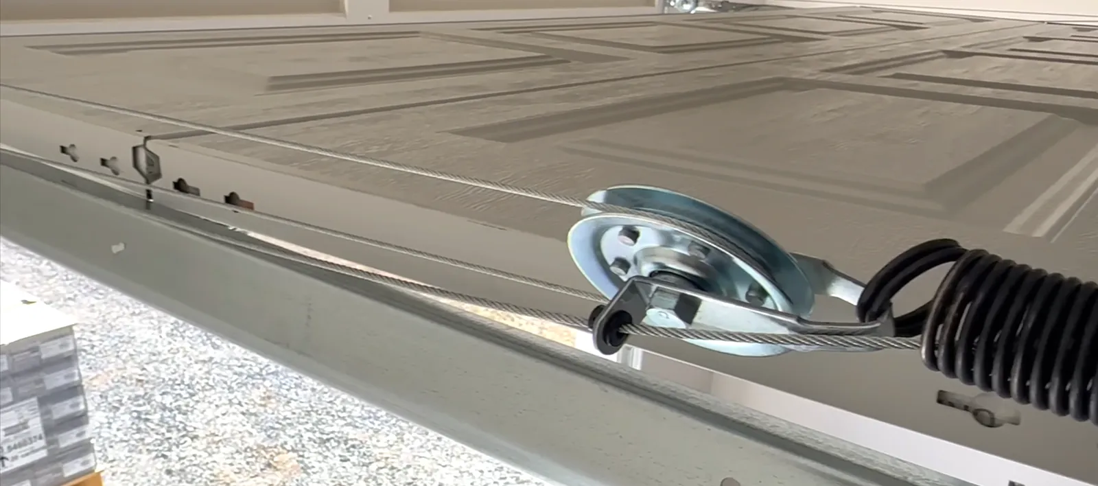 Garage door hardware adjustment in Denver